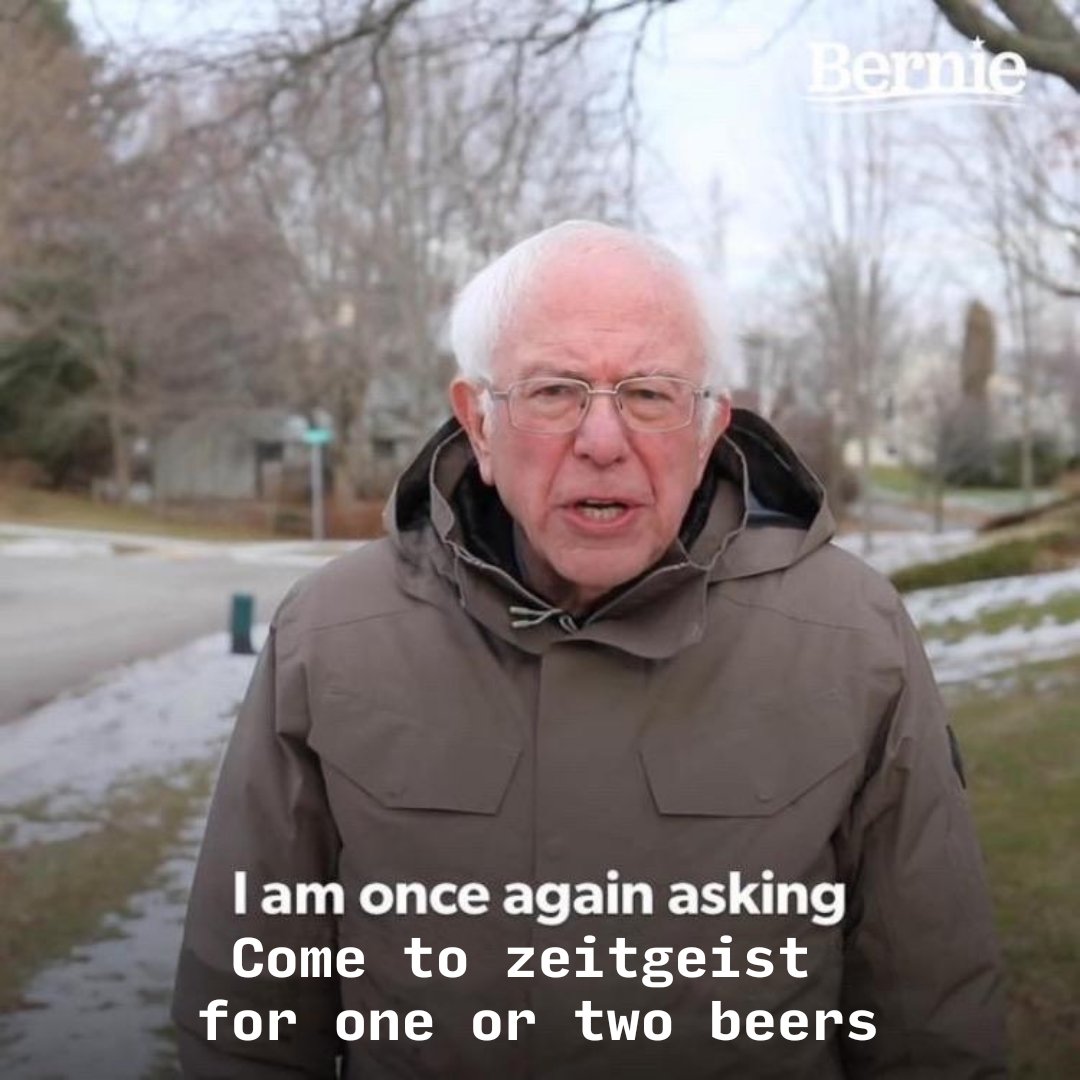 Bernie Sanders stands outdoors in a brown winter coat with a serious expression. Text is overlaid on the bottom of the image.